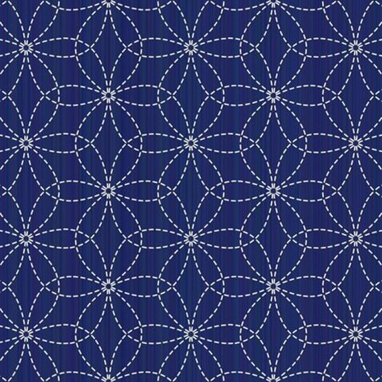 Cercle à broder avec motif floral en cours de réalisation sur du tulle